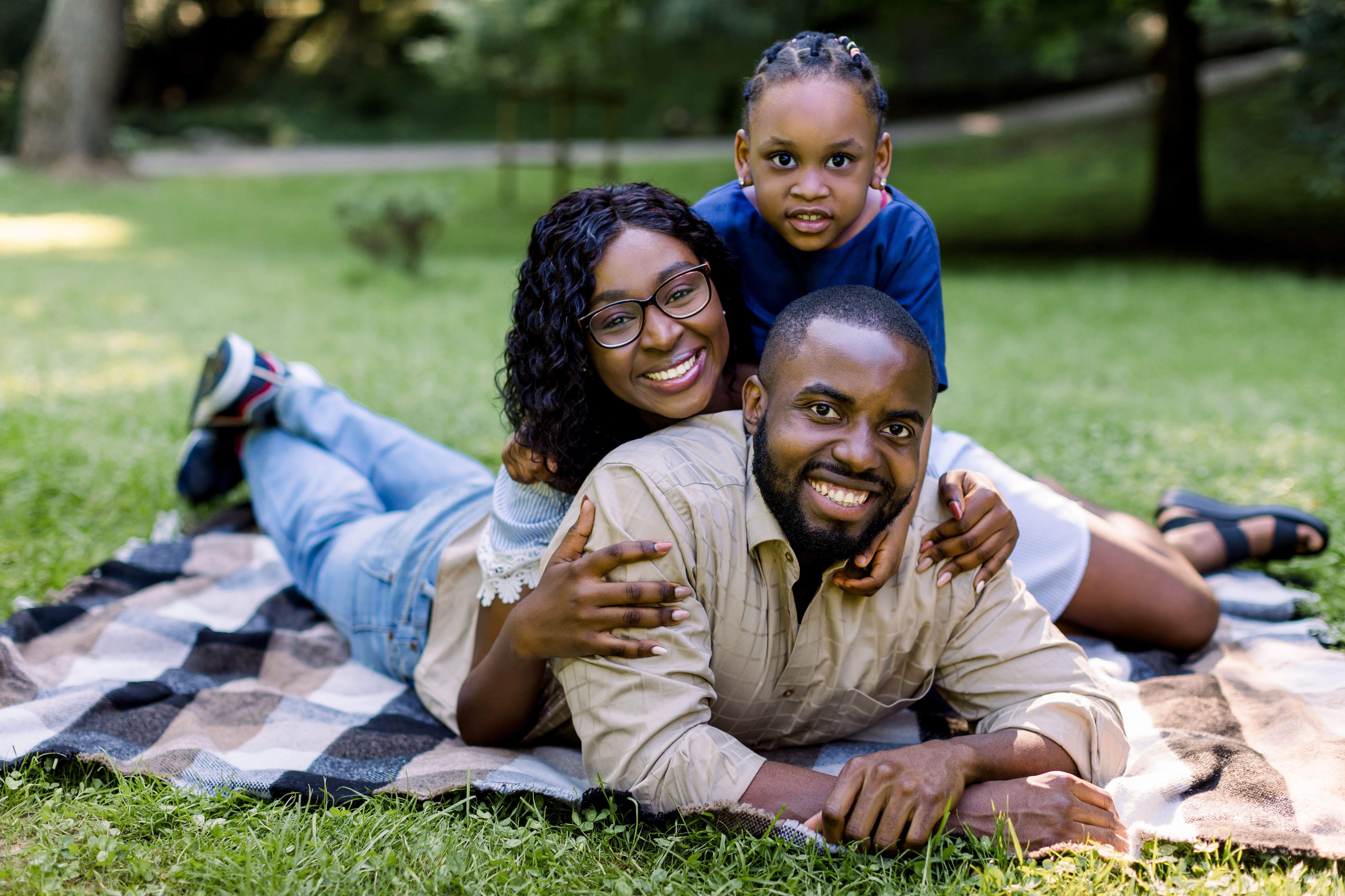 A family smiling and spending time together in their home.